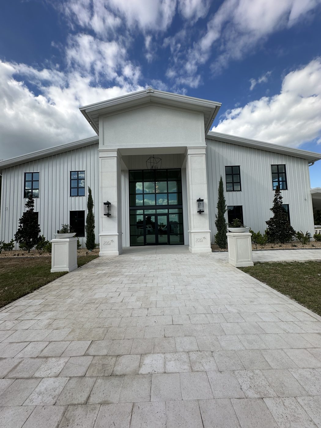 Commercial building with tall black-framed entry glass