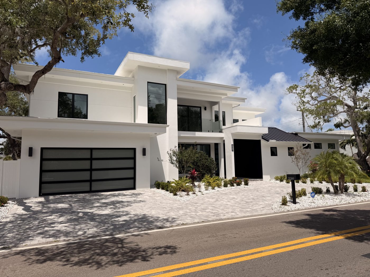 Modern white home with black-framed windows